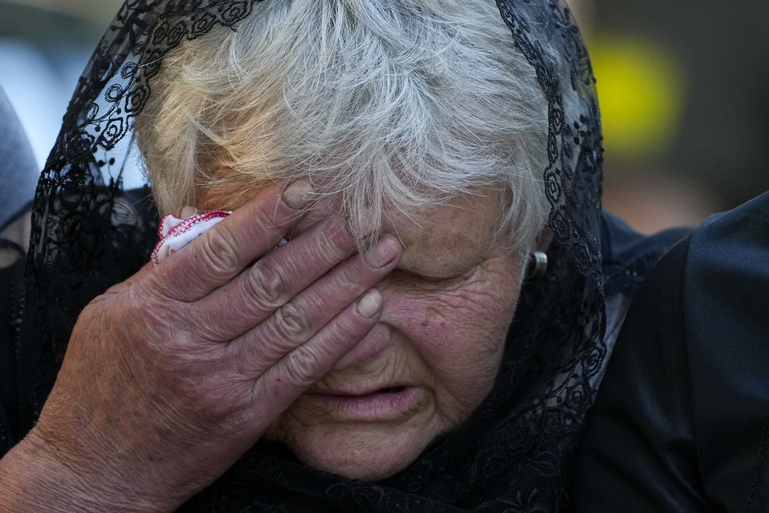  The mother of Army Col. Oleksander Makhachek mourns during his funeral service in Zhytomyr, Ukraine, Friday, June 3, 2022. According to combat comrades, Makhachek was killed fighting Russian forces when a shell landed in his position on May 30. (AP 