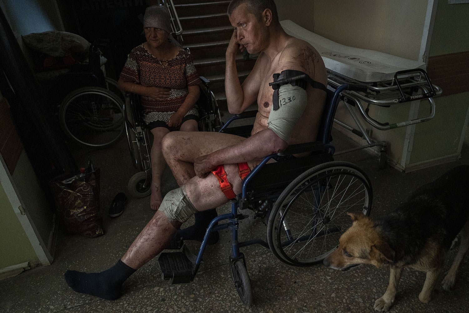  An injured Ukrainian serviceman and an injured civilian wait for medical treatment in the Donetsk region of eastern Ukraine, Tuesday, June 7, 2022. (AP Photo/Bernat Armangue) 