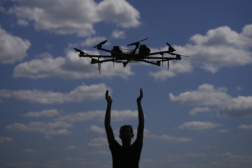 Oleg tests a drone on the outskirts of Kyiv, Ukraine, Wednesday, June 8, 2022. (AP Photo/Natacha Pisarenko) 