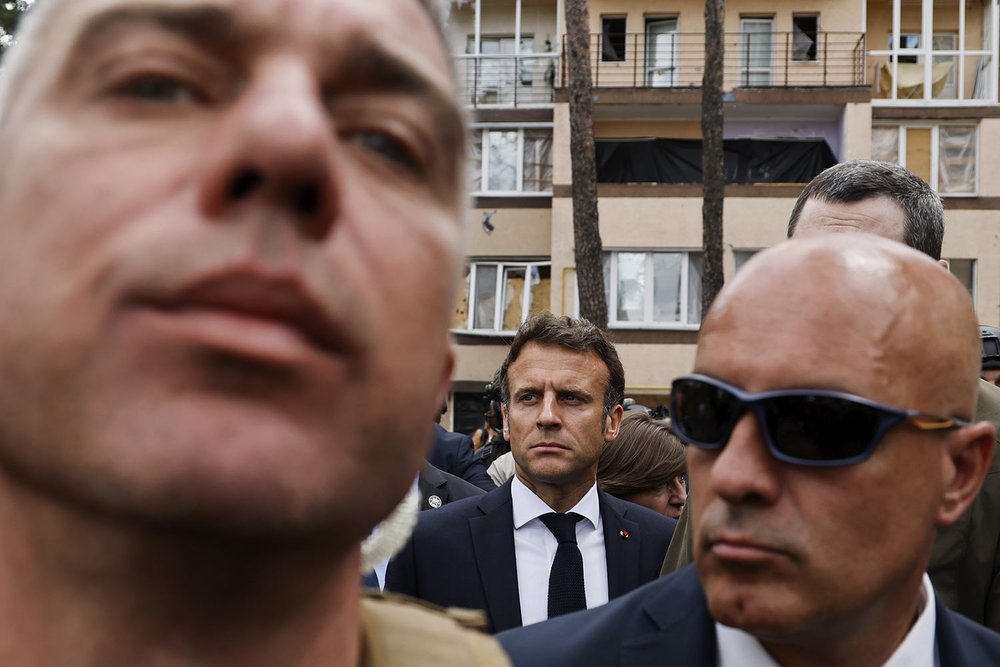  Surrounded by a security detail, French President Emmanuel Macron, center, visits Irpin, on the outskirts of Kyiv, Thursday, June 16, 2022. The leaders of France, Germany, Italy and Romania arrived in Kyiv on Thursday in a show of collective Europea