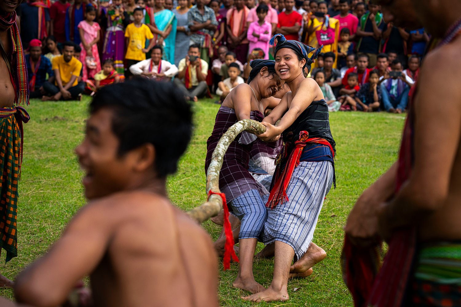  Indian Rabha tribal women in traditional attire take part in a tug of war competition with men during Baikho festival at Gamerimura village along the Assam Meghalaya border, west of Gauhati, India, Saturday, June 4, 2022. (AP Photo/Anupam Nath) 