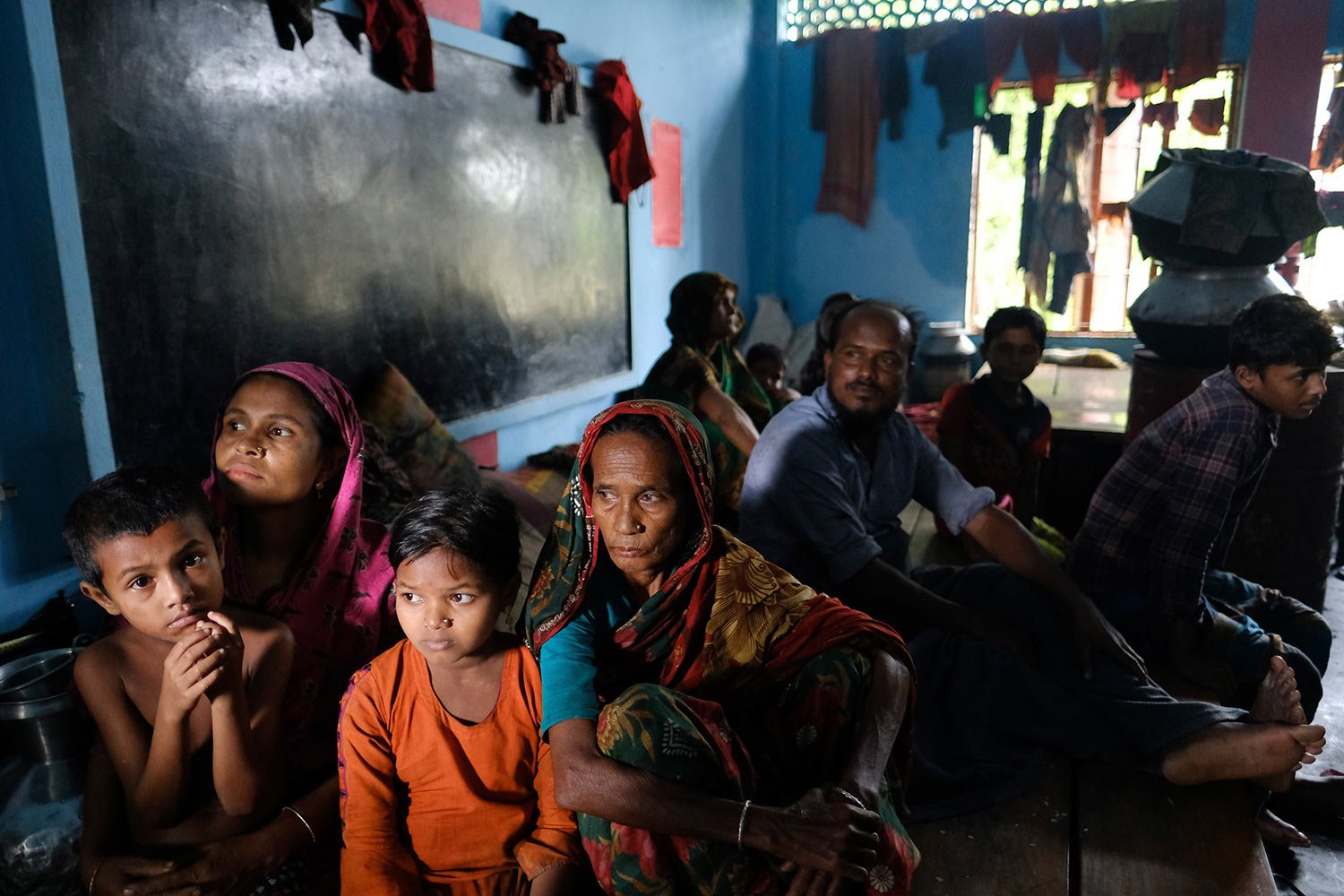  Flood affected people sit at a shelter at Companygonj in Sylhet, Bangladesh, Monday, June 20, 2022.  (AP Photo/Mahmud Hossain Opu) 