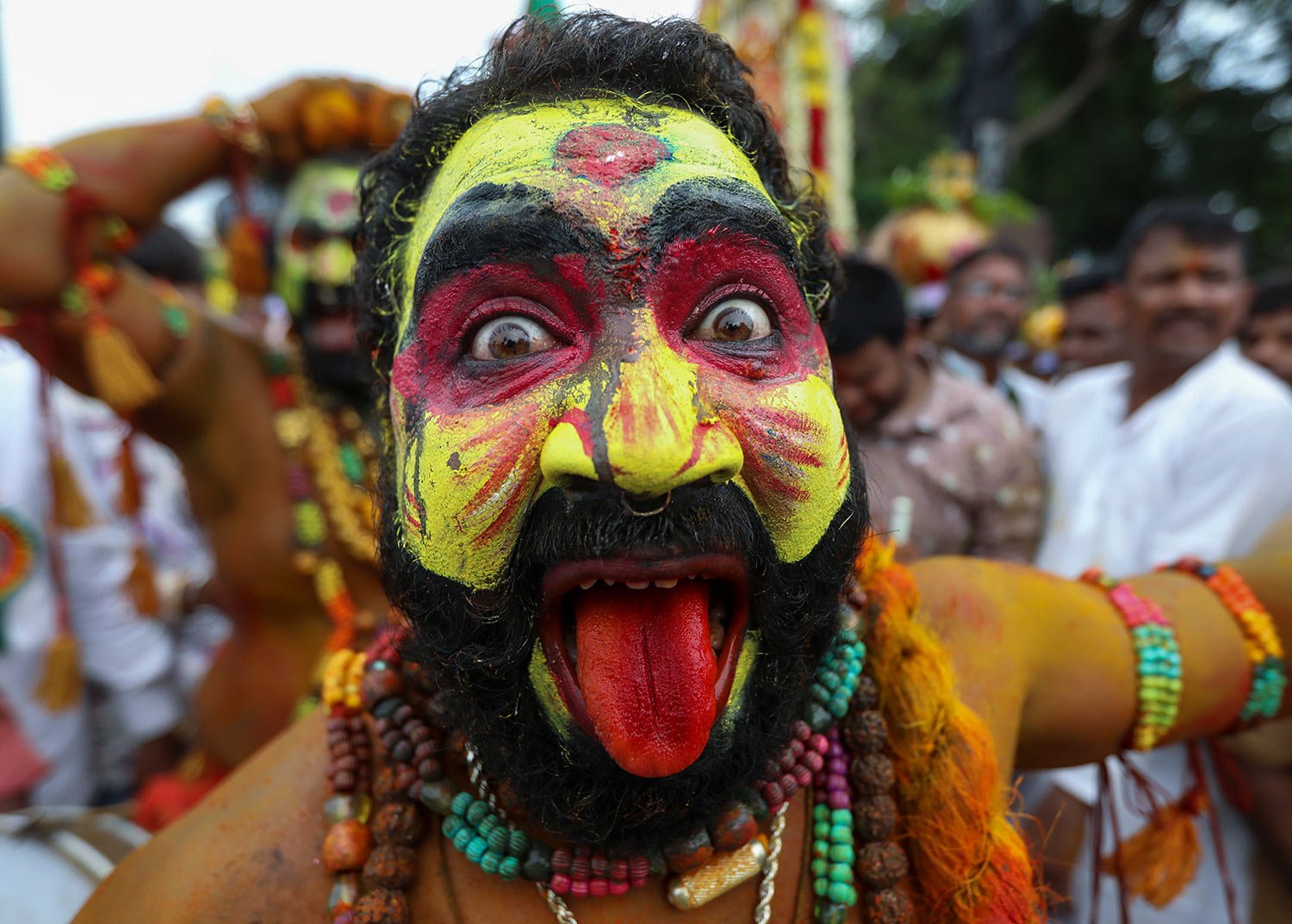  A man dressed as Pothuraju, a mythical character, performs rituals during the Bonalu festival in Hyderabad, India, Thursday, June 30, 2022. (AP Photo/Mahesh Kumar A.) 