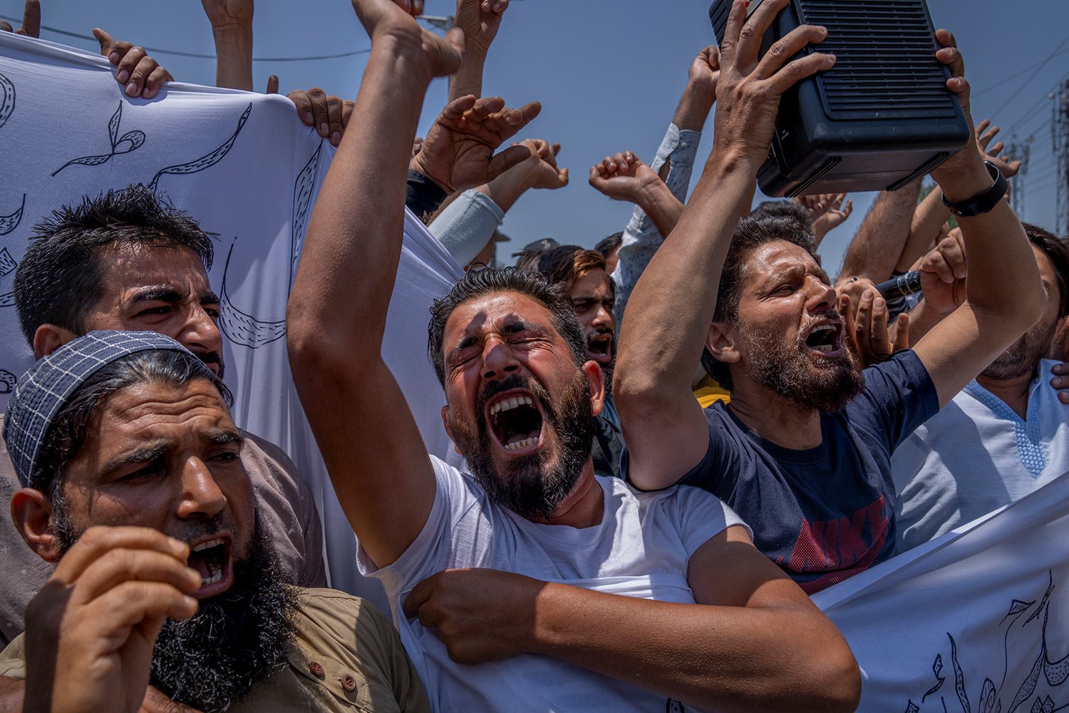  Kashmiri traders shout Islamic slogans during a protest against Nupur Sharma, a spokesperson of governing Hindu nationalist party over her remarks about Prophet Mohammed, during a protest in Srinagar, Indian controlled Kashmir, Friday, June 10, 2022