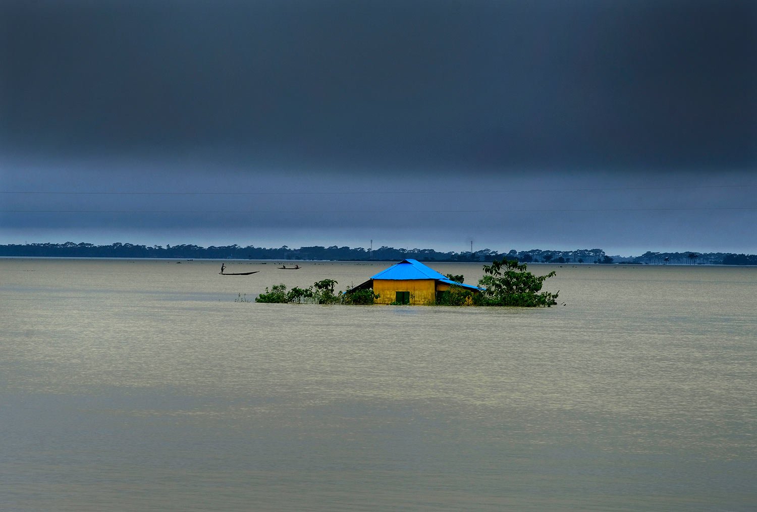  A house in marooned by flood waters in Sylhet, Bangladesh, Monday, June 20, 2022. (AP Photo/Mahmud Hossain Opu) 