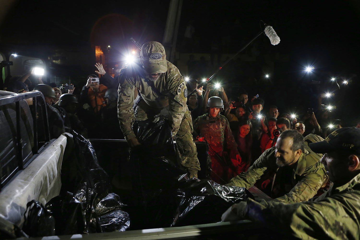  Federal police officers load body bags with recovered human remains onto a police vehicle after being found during a search for Indigenous expert Bruno Pereira of Brazil and freelance reporter Dom Phillips of Britain, in Atalaia do Norte, Amazonas s