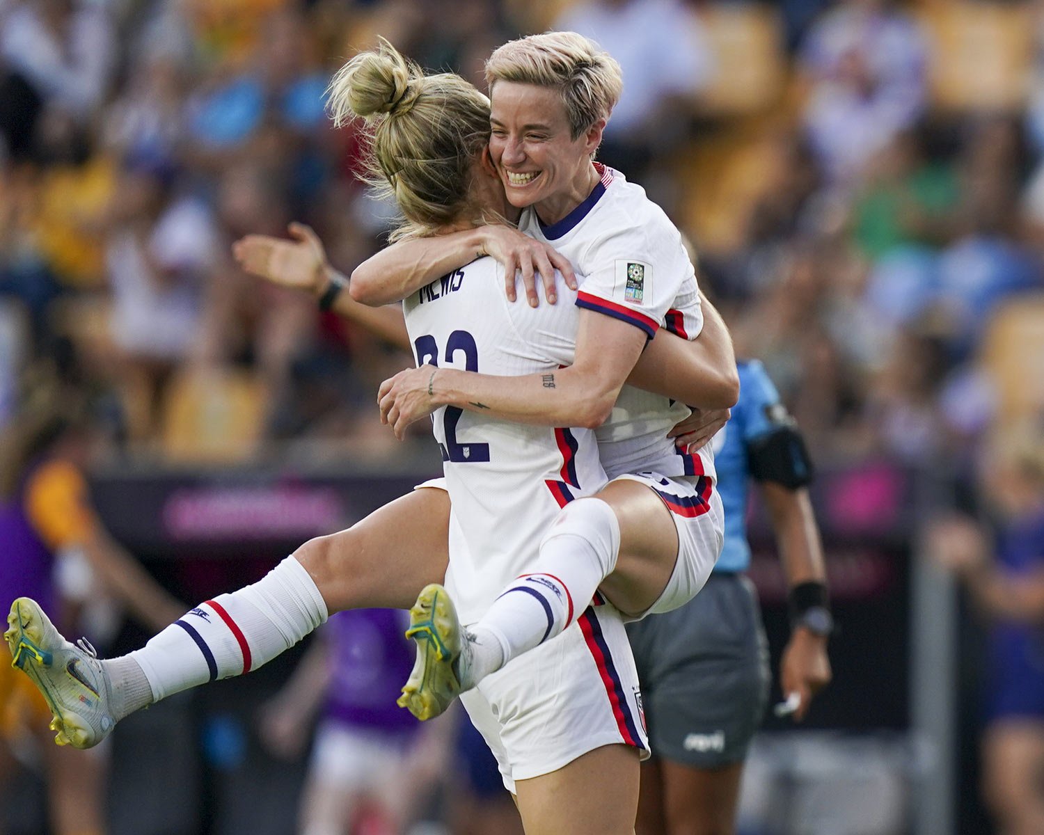  United States' Kristie Mewis, left, and Megan Rapinoe celebrate their side's third goal scored by Ashley Sanchez against Costa Rica during a CONCACAF Women's Championship soccer semifinal match in Monterrey, Mexico, Thursday, July 14, 2022. (AP Phot