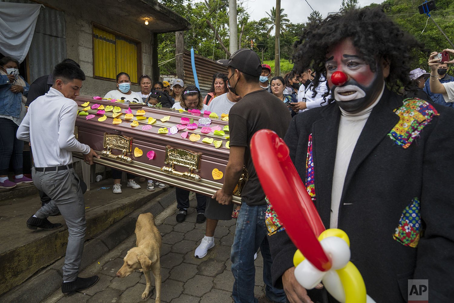 Relatives carry the coffin of Joselin Chacón Lobo known as "Chispita," before her funeral procession in Amatitlan, Guatemala, Sunday, July 3, 2022. Chacón Lobo disappeared for almost two months along with her partner, Nelson Estiven Villatoro, who a