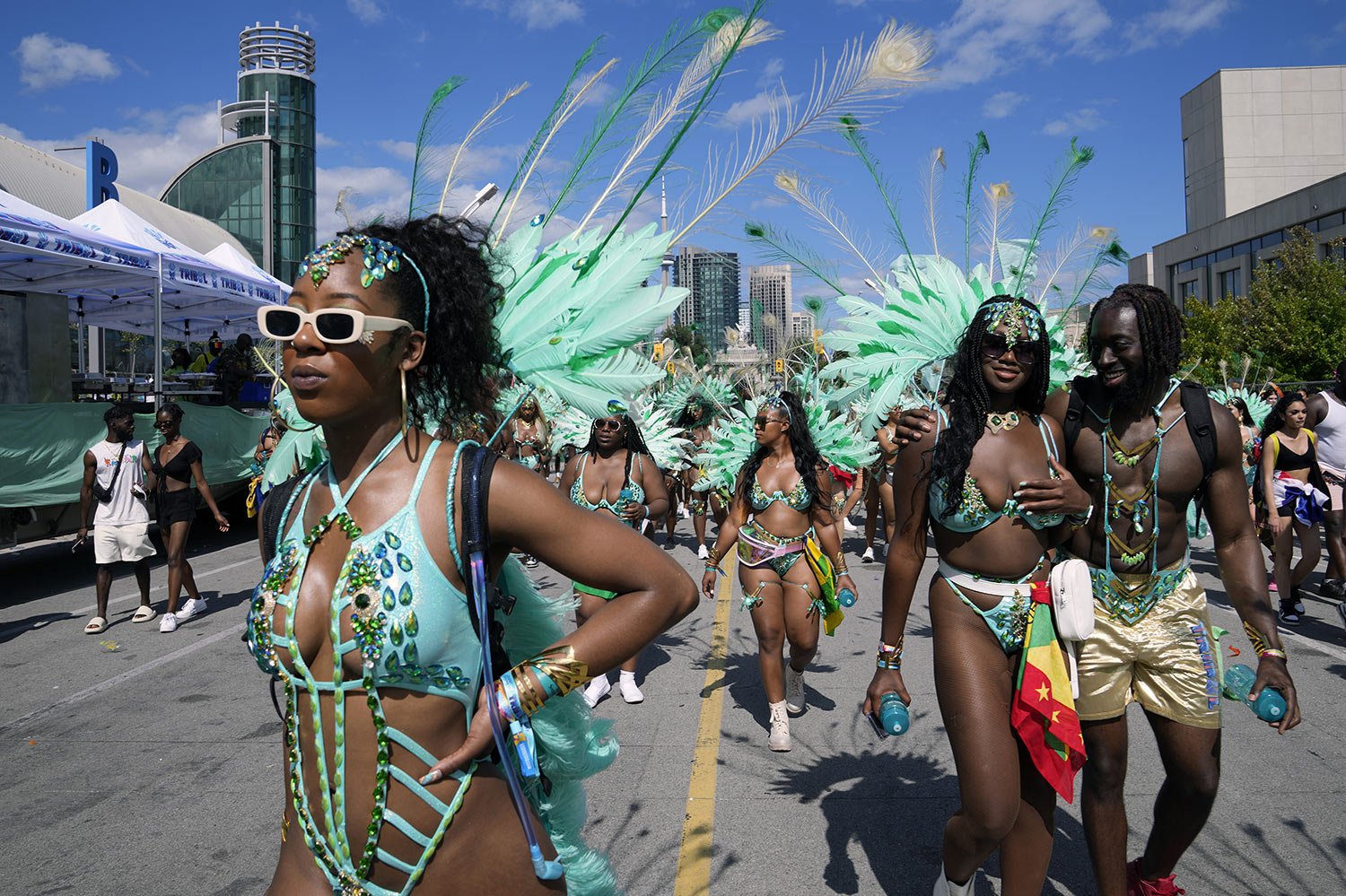  Masqueraders take part in the Caribbean Carnival parade in Toronto, Canada, Saturday, July 30, 2022. (AP Photo/Kamran Jebreili) 