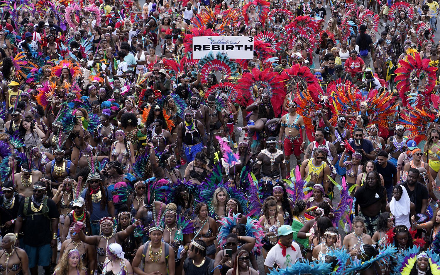  Masqueraders attend the Caribbean Carnival parade in Toronto, Canada, Saturday, July 30, 2022. (AP Photo/Kamran Jebreili) 