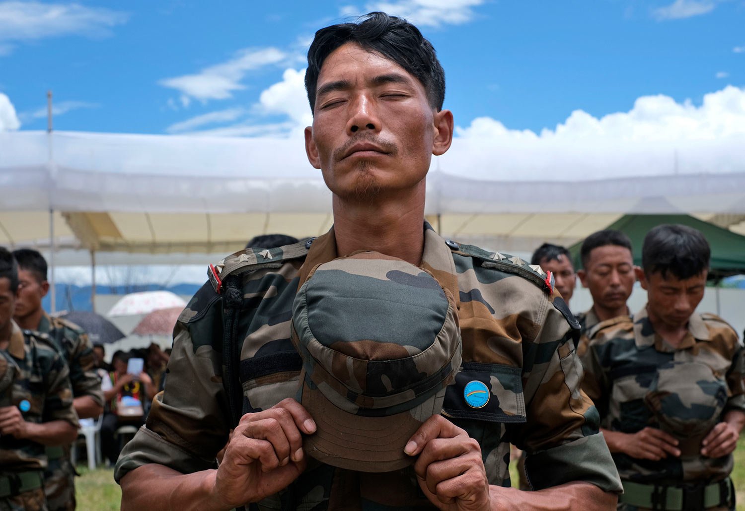  A Naga Army soldier stands in prayer during celebrations marking the Nagas' Declaration of Independence in Chedema, in the northeastern Indian state of Nagaland, Sunday, Aug. 14, 2022.  (AP Photo/Yirmiyan Arthur) 