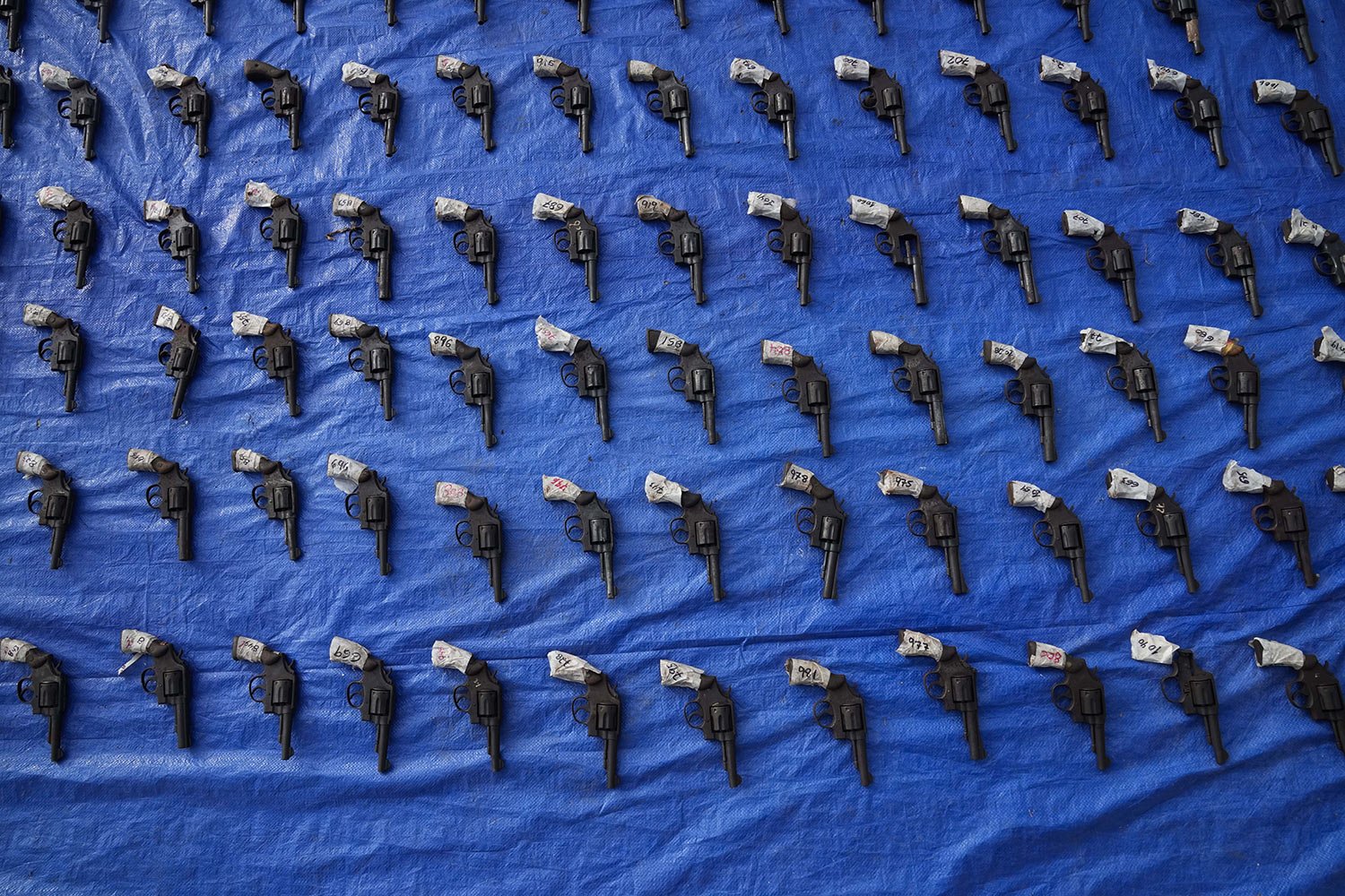  Seized pistols are presented to the media before they are set to be destroyed at police headquarters in Panama City, Friday, Aug. 26, 2022. (AP Photo/Arnulfo Franco) 