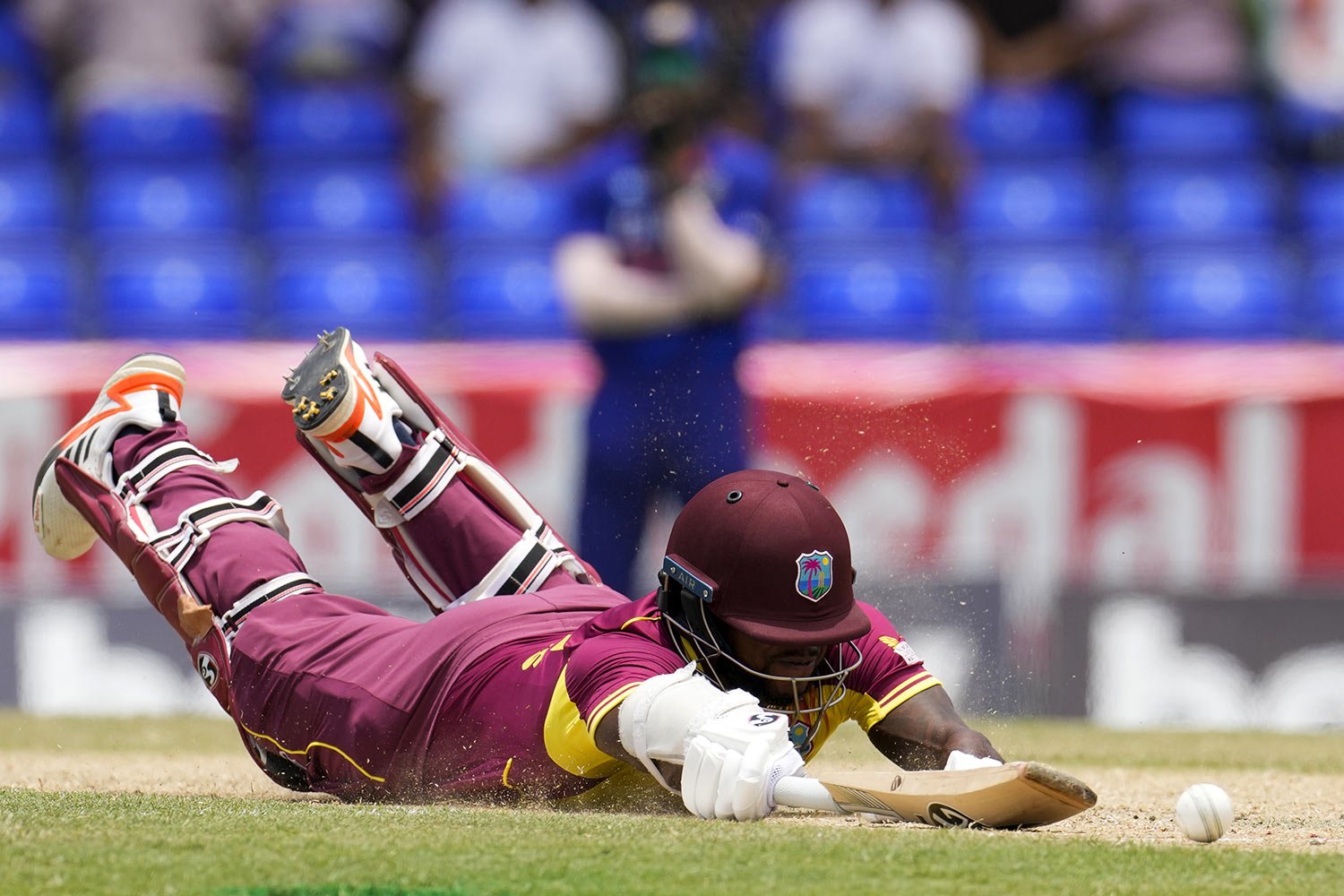  West Indies' Kyle Mayers safely makes his ground during the third T20 cricket match against India at Warner Park in Basseterre, St. Kitts and Nevis, Tuesday, Aug. 2, 2022. (AP Photo/Ricardo Mazalan) 