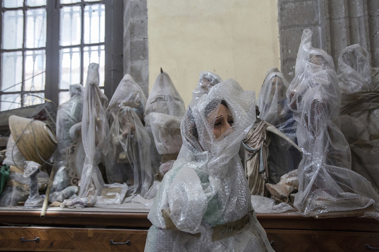  Religious statues protected with bubble wrap sit in storage inside Our Lady of the Angels Catholic church, in Mexico City, Sunday, Aug. 7, 2022. The National Institute of Anthropology and History is funding and carrying out the restoration of earthq