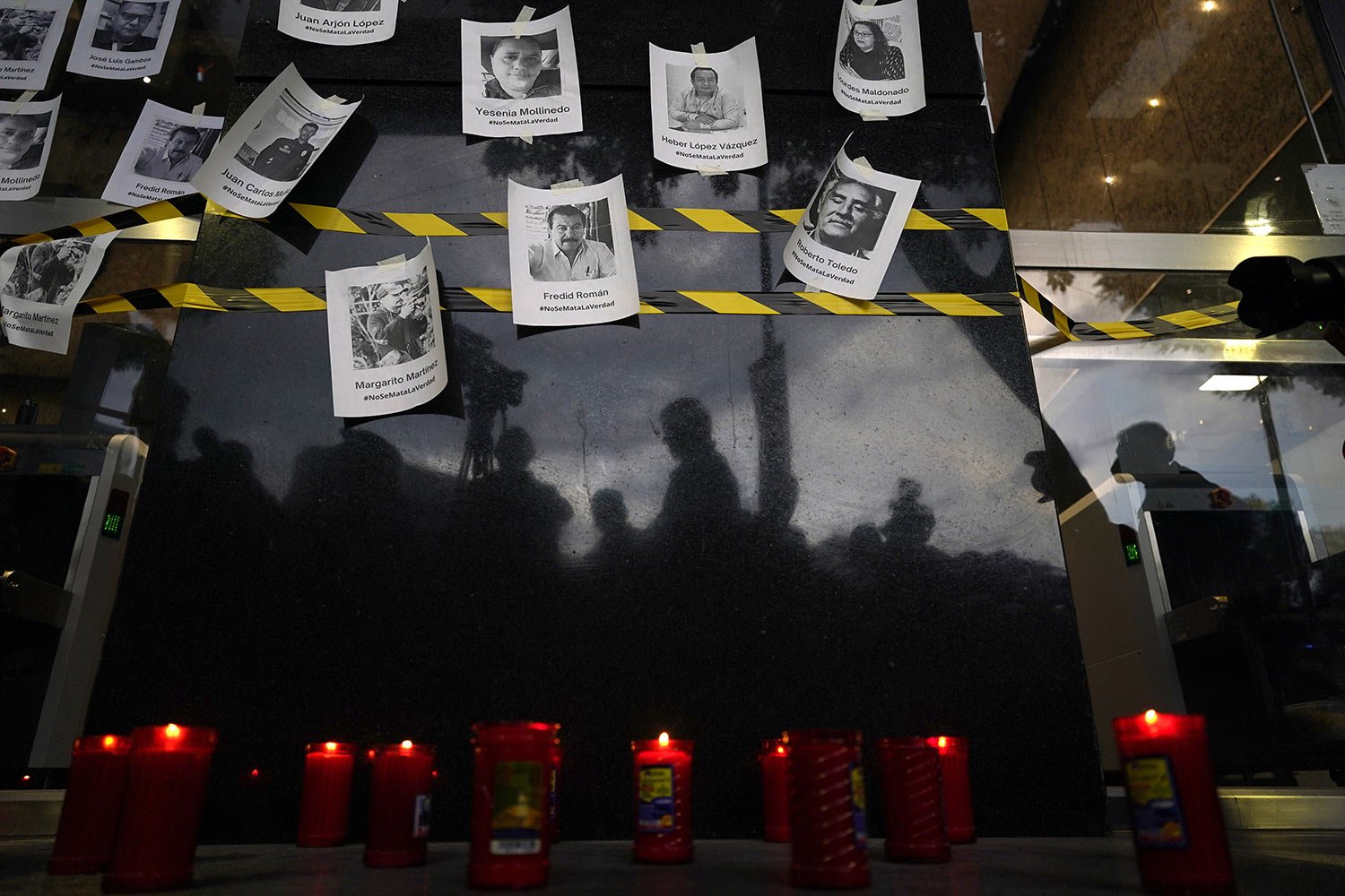  Photos of slain journalists are posted on a wall during a vigil to protest the murder of journalist Fredid Roman, outside the Attorney General's office in Mexico City, Wednesday, Aug. 24, 2022. Roman was the 15th media worker killed so far this year