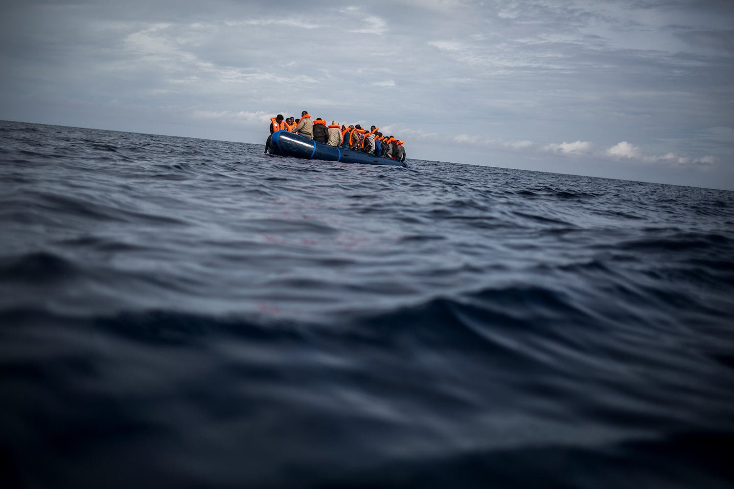  Migrants sail on a rubber dinghy after Spanish NGO Pro activa Open Arms spotted and rescued them at Alboran Sea, about 40 miles (64 kms) from the Spanish coasts, Oct. 11 2018. (AP Photo/Javier Fergo) 