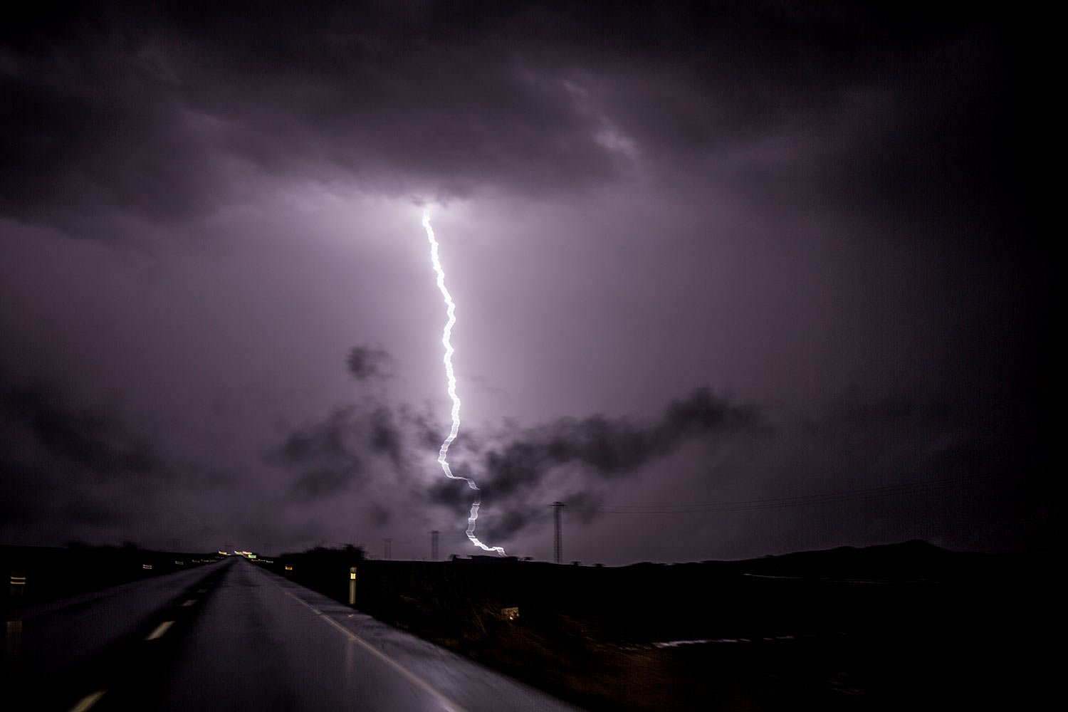 Lightning strikes ground on the outskirts of the village of Campillos, Spain, where heavy rain and floods caused much damage and the death of a firefighter according to Spanish authorities, Oct. 21 2018.  (AP Photo/Javier Fergo) 