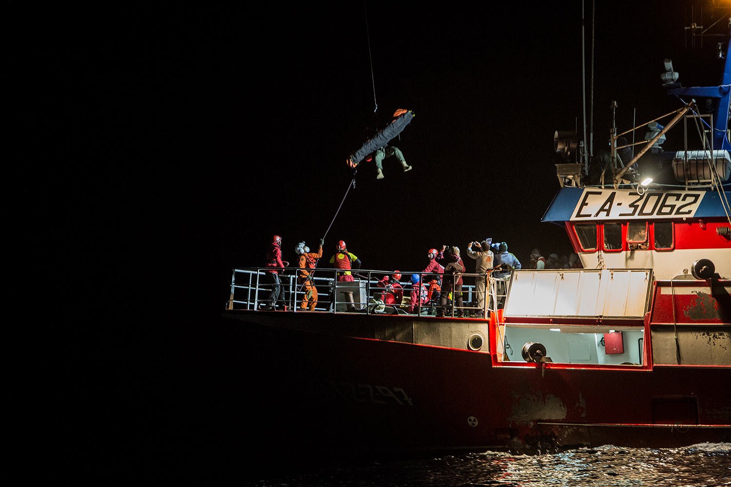  In this Nov. 30, 2018, photo, a sick migrant is evacuated by helicopter from the Nuestra Madre de Loreto Spanish fishing vessel carrying 12 migrants rescued off the coast of Libya. (AP Photo/Javier Fergo) 