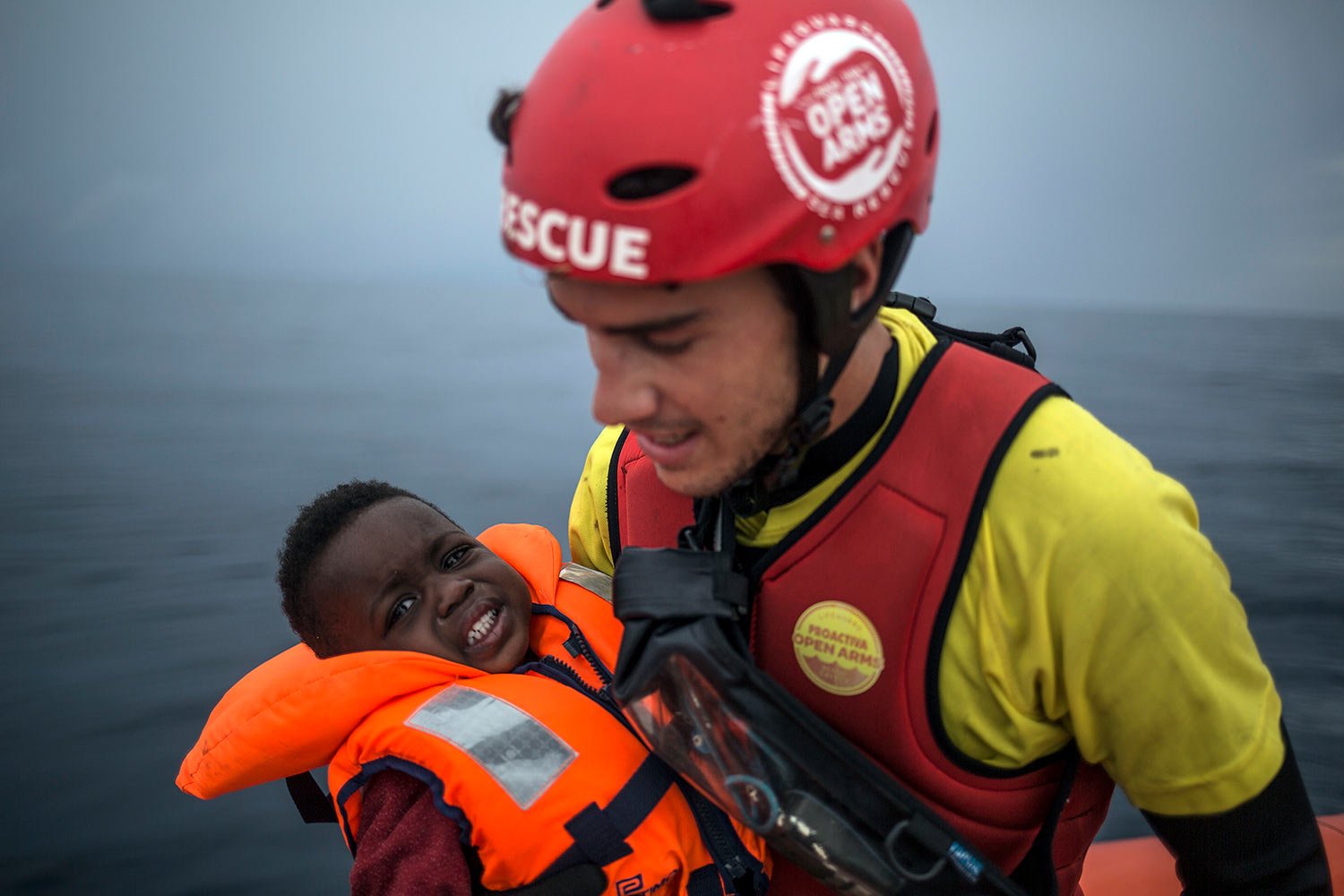  A member of Spanish NGO Pro activa Open Arms holds a baby rescued at a dinghy at Alboran Sea, about 40 miles (64 kms) from the Spanish coasts, Oct. 11 2018. The Open Arms is now based at Motril port in order to start operating in the western Mediter
