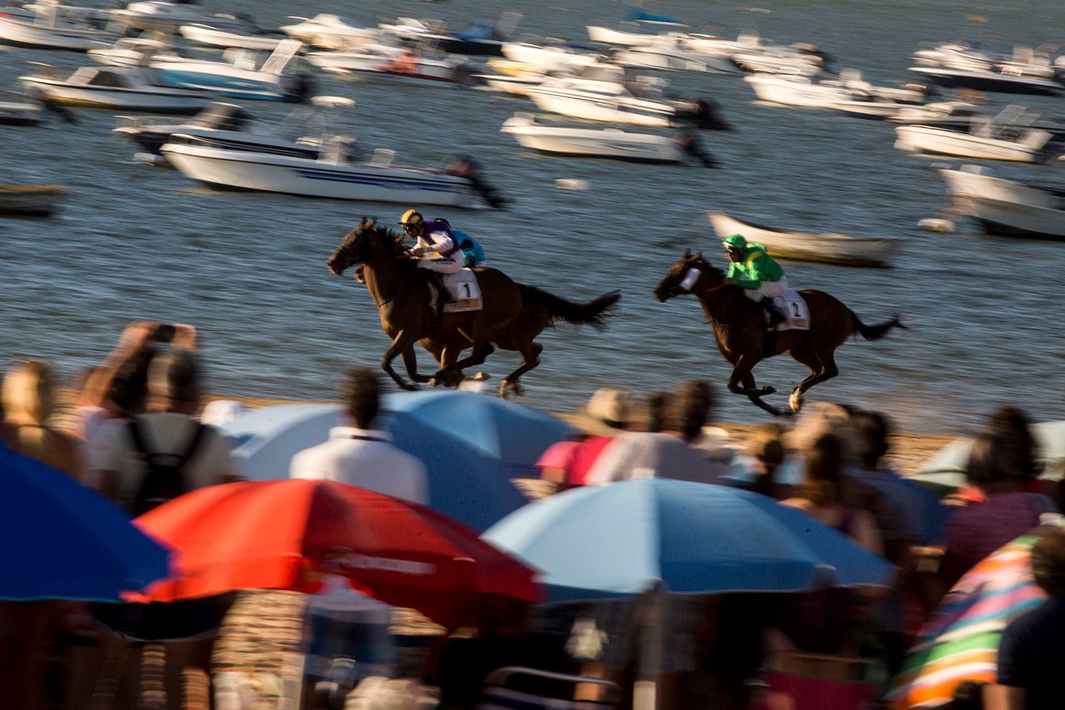  Horses race along the beach at Sanlucar de Barrameda, Spain, Aug. 10, 2019. Beach races are a yearly event that have been running for over 140 years. (AP Photo/Javier Fergo) 