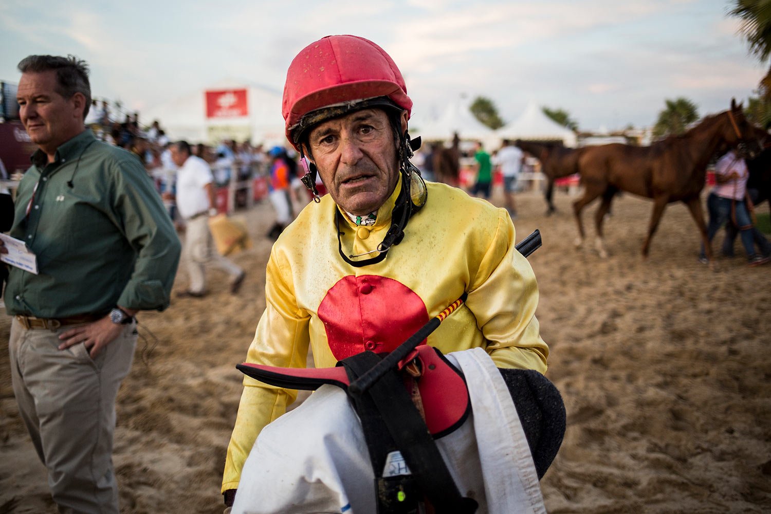  A jockey walks back after a race along the beach at Sanlucar de Barrameda, Spain, August 11, 2019. Beach races are a yearly event that has been running for over 140 years. (AP Photo/Javier Fergo) 