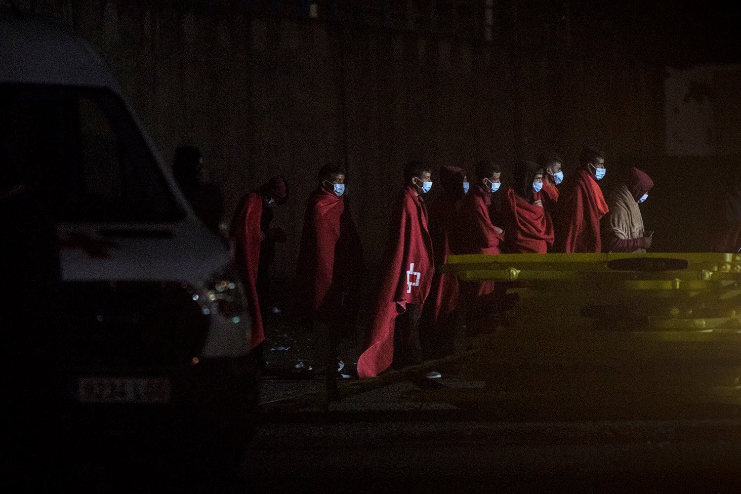  Migrants stand at Arguineguin port after their rescue on the southwestern coast of the Gran Canaria island, Spain, Dec. 01, 2020. (AP Photo/Javier Fergo) 