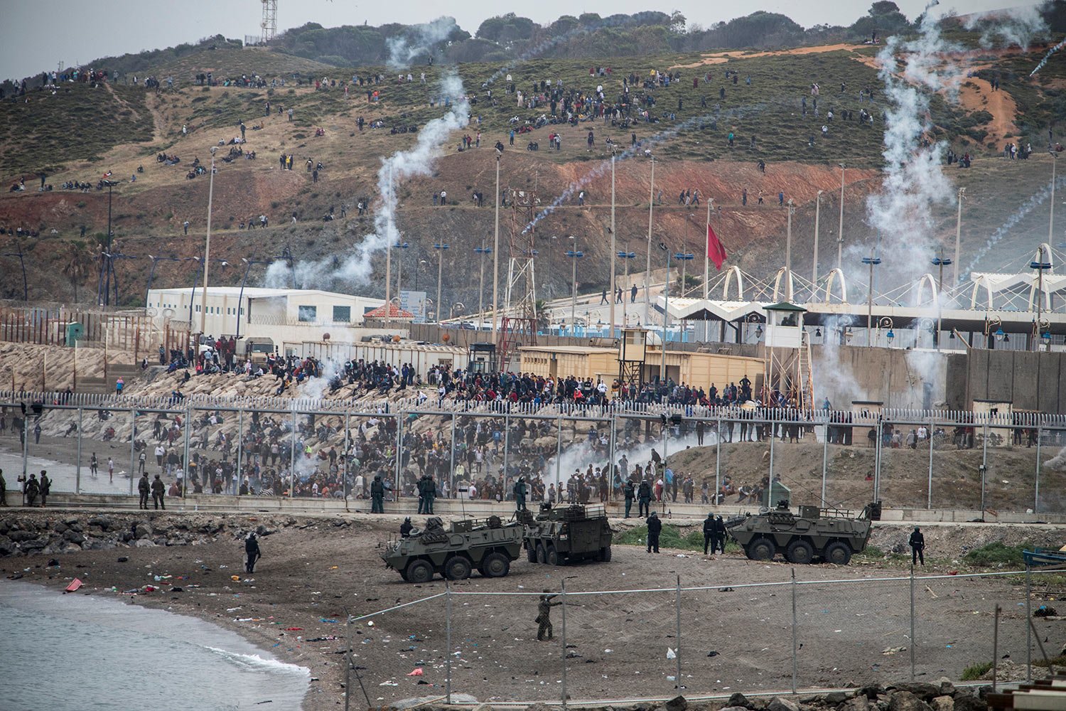  Spanish Army and Guardia Civil officers take positions next to the border of Morocco and Spain, at the Spanish enclave of Ceuta, May 18, 2021. (AP Photo/Javier Fergo) 