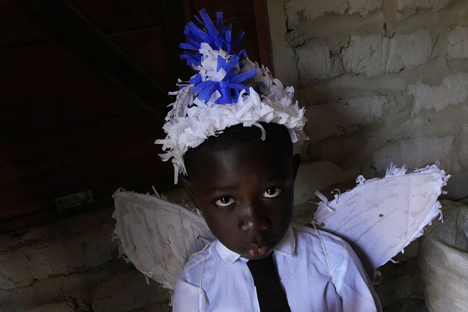  A youth in an angel costume poses for a photo at the end of a week-long pilgrimage honoring the patron saint in Cavalcante, Goias state, Brazil, Aug. 15, 2022. (AP Photo/Eraldo Peres) 