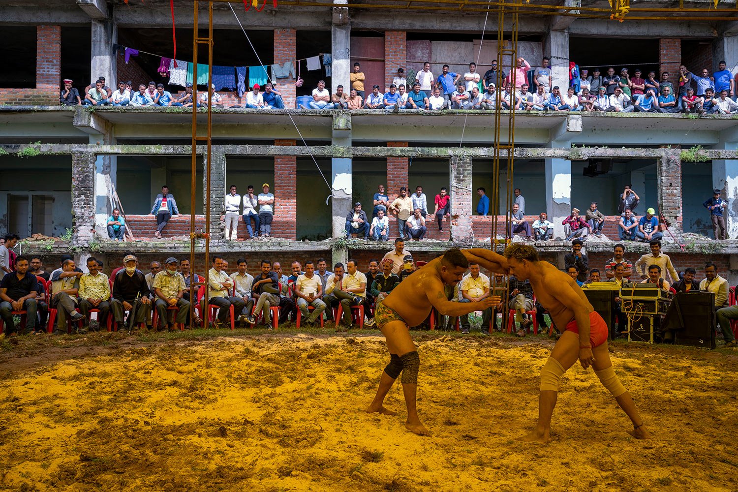  Wrestlers compete at a local fair in Dharmsala, India, Tuesday, Sept. 6, 2022. (AP Photo/Ashwini Bhatia) 