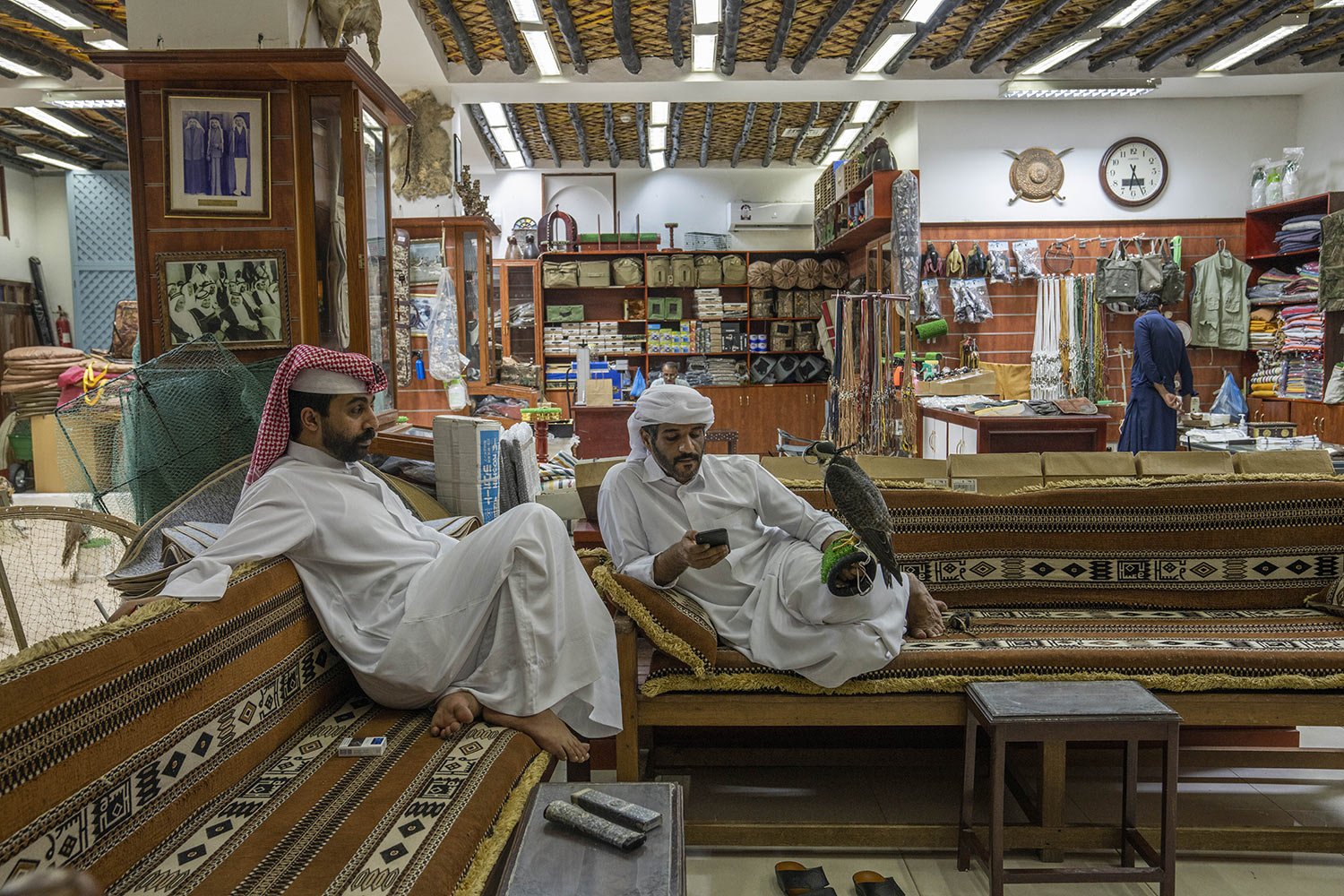  Salesmen sit in their falcon shop in Souq Waqif, Doha, Qatar, Sunday, Oct. 16, 2022. (AP Photo/Nariman El-Mofty) 