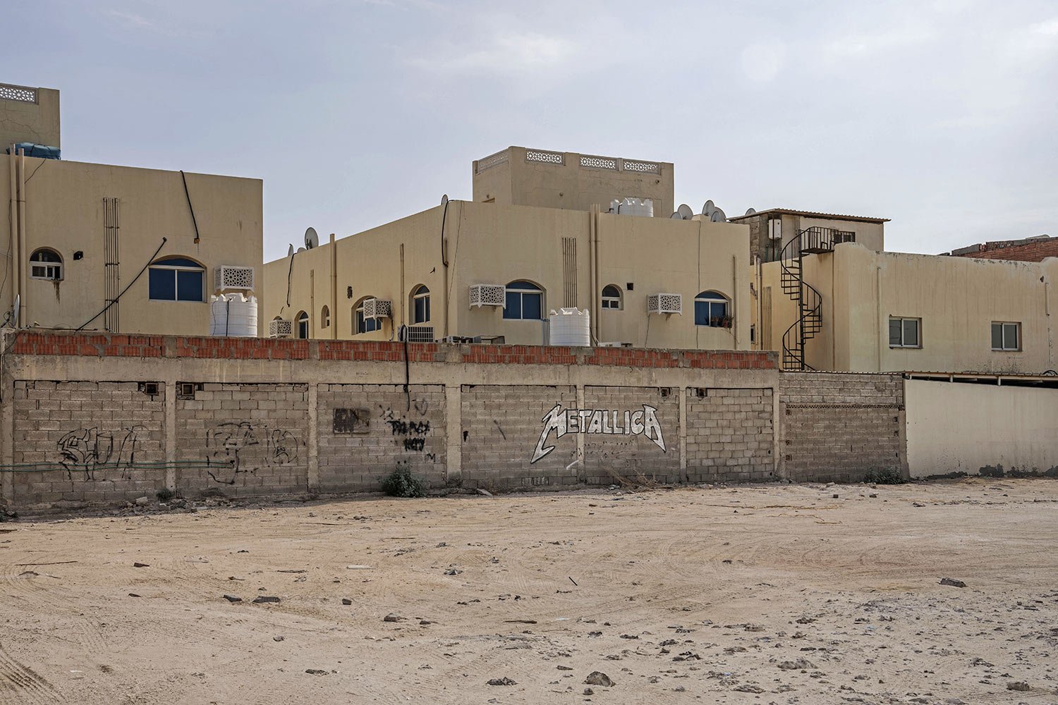  A Metallica band logo is inscribed on a wall of a residential block in Al Rayyan, Doha, Qatar, Saturday, Oct. 15, 2022. (AP Photo/Nariman El-Mofty) 
