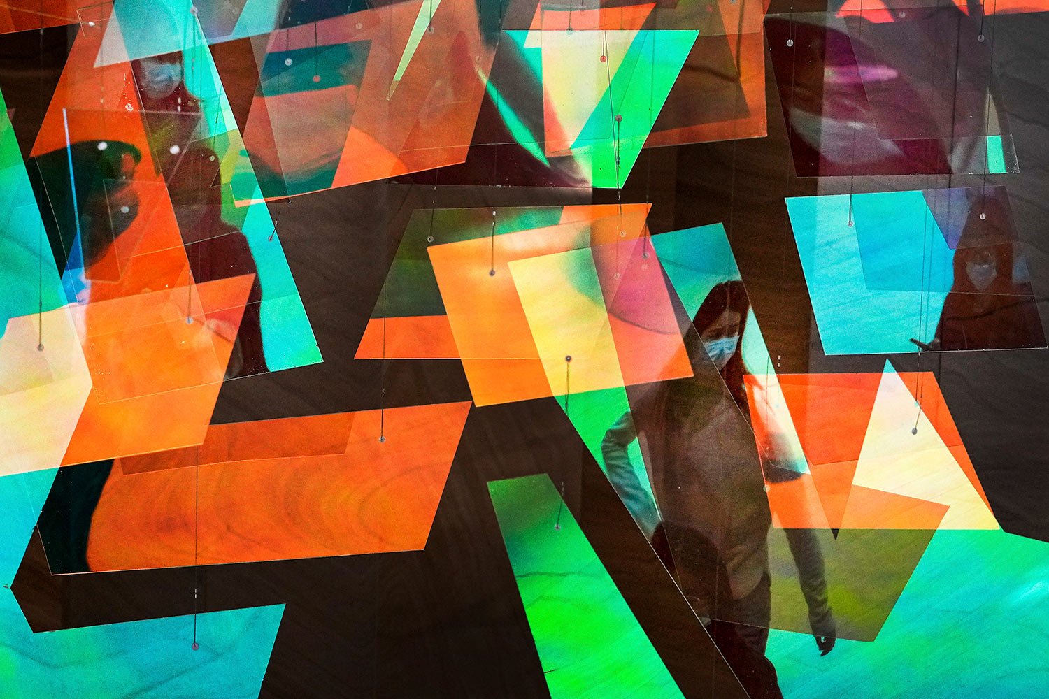  The colorful panels reflecting women wearing face masks visiting a shopping mall in Beijing, Tuesday, Oct. 4, 2022. (AP Photo/Andy Wong) 