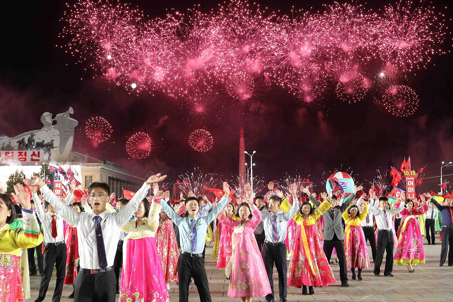  Youth and students attend an evening gala with a firework display to celebrate the 77th anniversary of the founding of the Workers' Party of Korea at the Kim Il Sung Square in Pyongyang, North Korea Monday, Oct. 10, 2022. (AP Photo/Jon Chol Jin) 