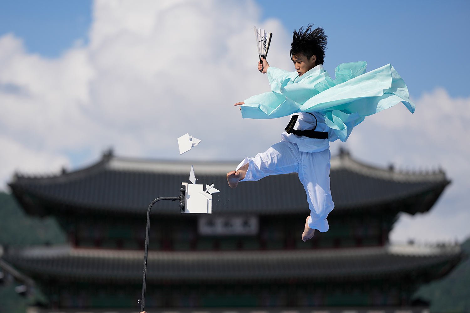  A member of Taekwondo demonstration team breaks plates during the Taekwondo demonstration near the Gwanghwamun, one of South Korea's well-known landmarks, at a square in downtown Seoul, South Korea, Friday, Oct. 7, 2022. (AP Photo/Lee Jin-man) 