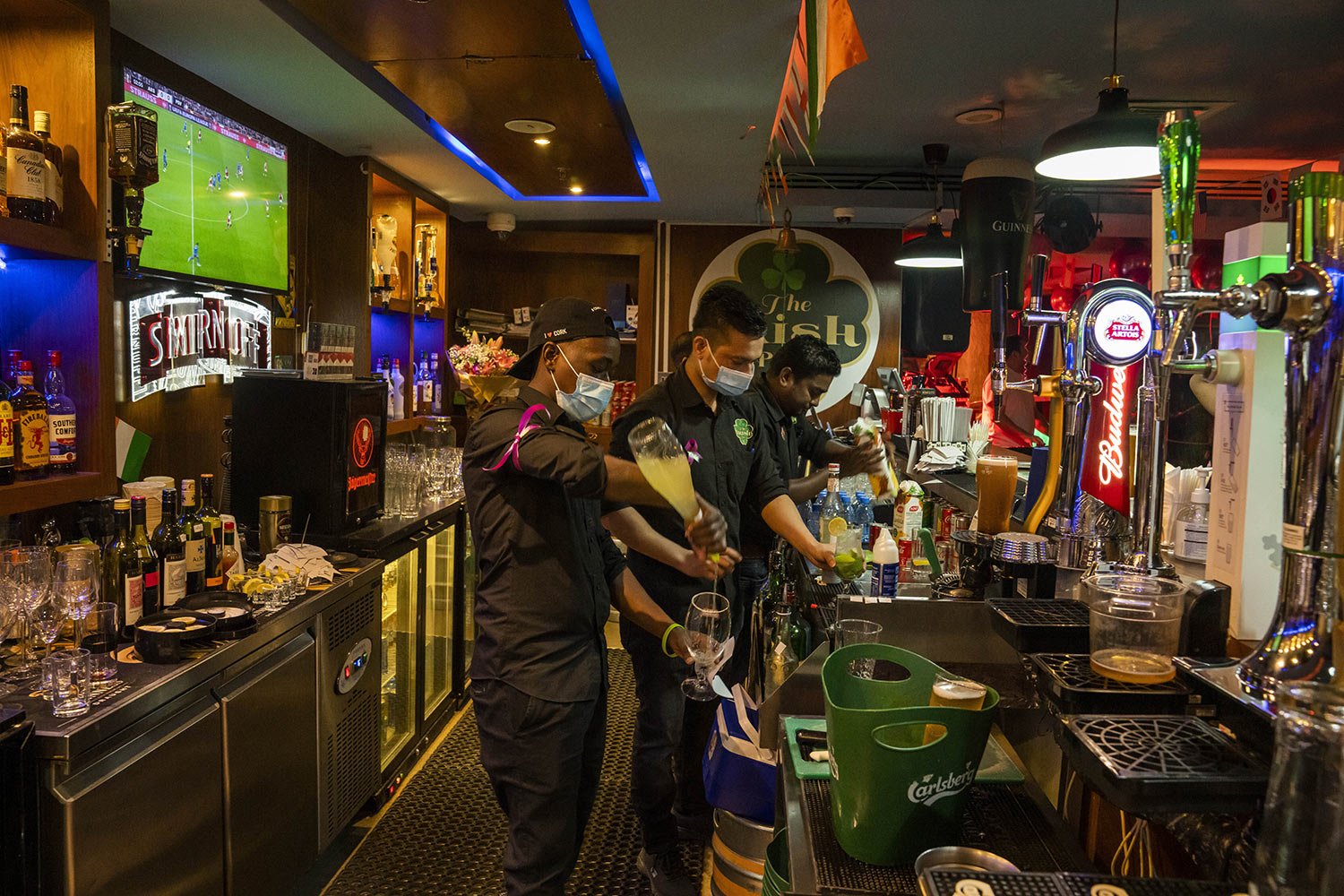  Baristas make drinks at "The Irish Pub," which will be one of the bars showing World Cup 2022 matches on live screens in Doha, Qatar, Thursday, Oct. 20, 2022. (AP Photo/Nariman El-Mofty) 