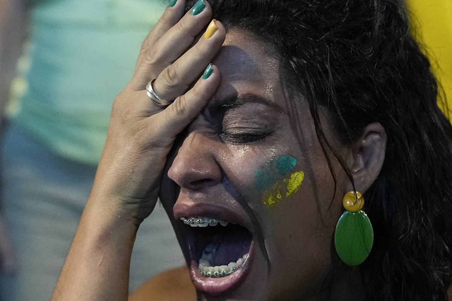  A supporter of incumbent President Jair Bolsonaro reacts to results after polls closed in a presidential run-off election, in Rio de Janeiro, Brazil, Sunday, Oct. 30, 2022. Brazil's electoral authority announced that former President Luiz Inacio Lul
