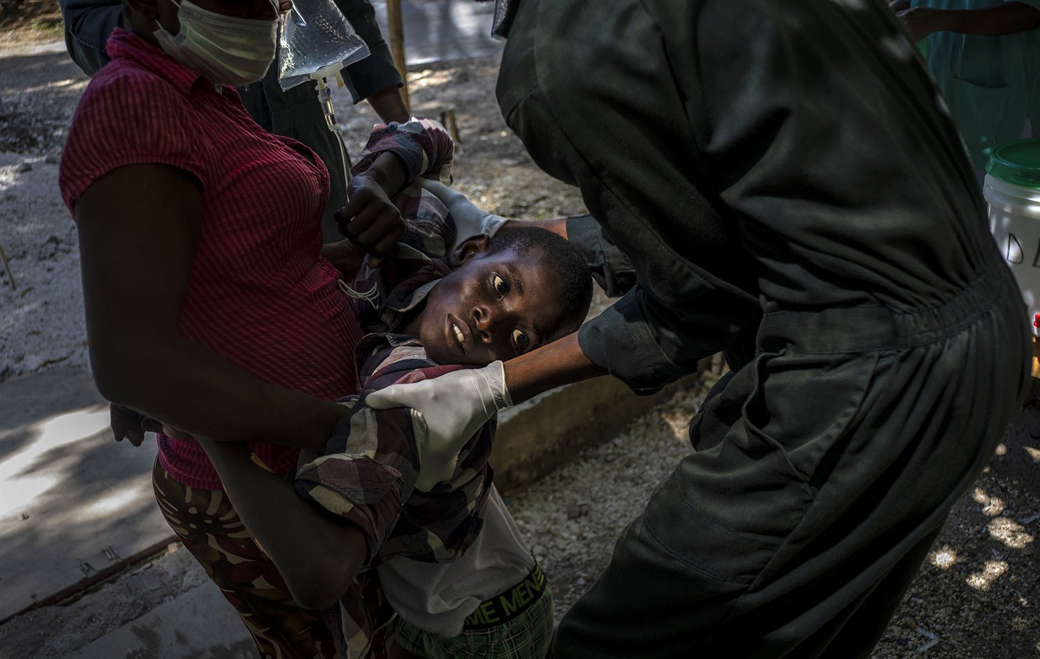  A youth suffering cholera symptoms is helped upon arrival at a clinic run by Doctors Without Borders in Port-au-Prince, Haiti, Thursday, Oct. 27, 2022. For the first time in three years, people in Haiti have been dying of cholera, raising concerns a