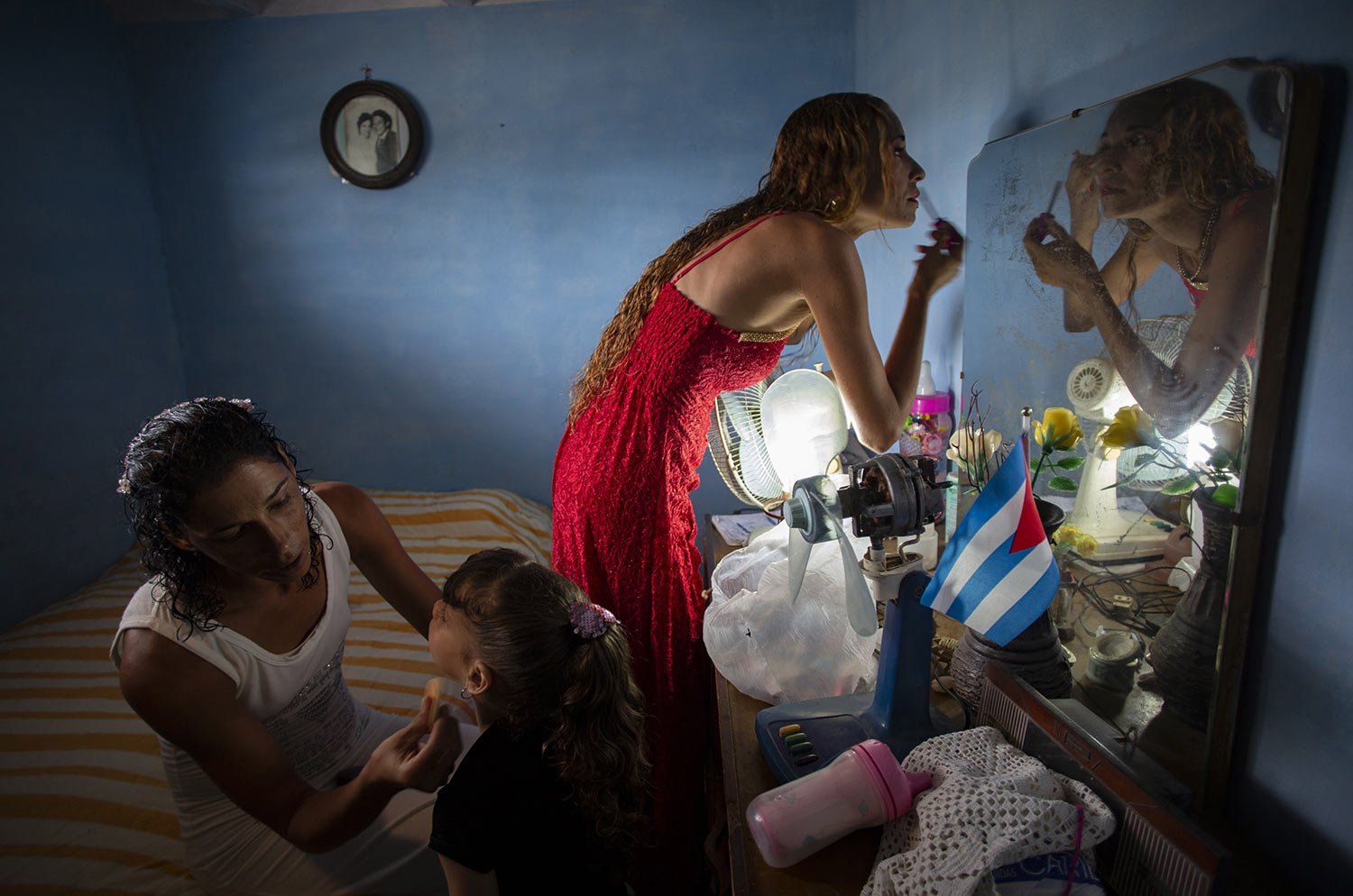  Liusba Grajales, left, puts makeup on her daughter Ainhoa as her partner Lisset Diaz Vallejo gets ready for their wedding ceremony, in Santa Clara, Cuba, Friday, Oct. 21, 2022. The couple, which has been together for seven years, is one of the first