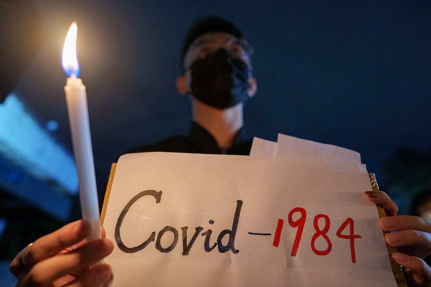  Student protesters hold up candles and placards during a commemoration for victims of a recent Urumqi apartment deadly fire blamed on the rigid anti-virus measures, held in Kuala Lumpur, Malaysia, Tuesday, Nov. 29, 2022.  (AP Photo/Vincent Thian) 