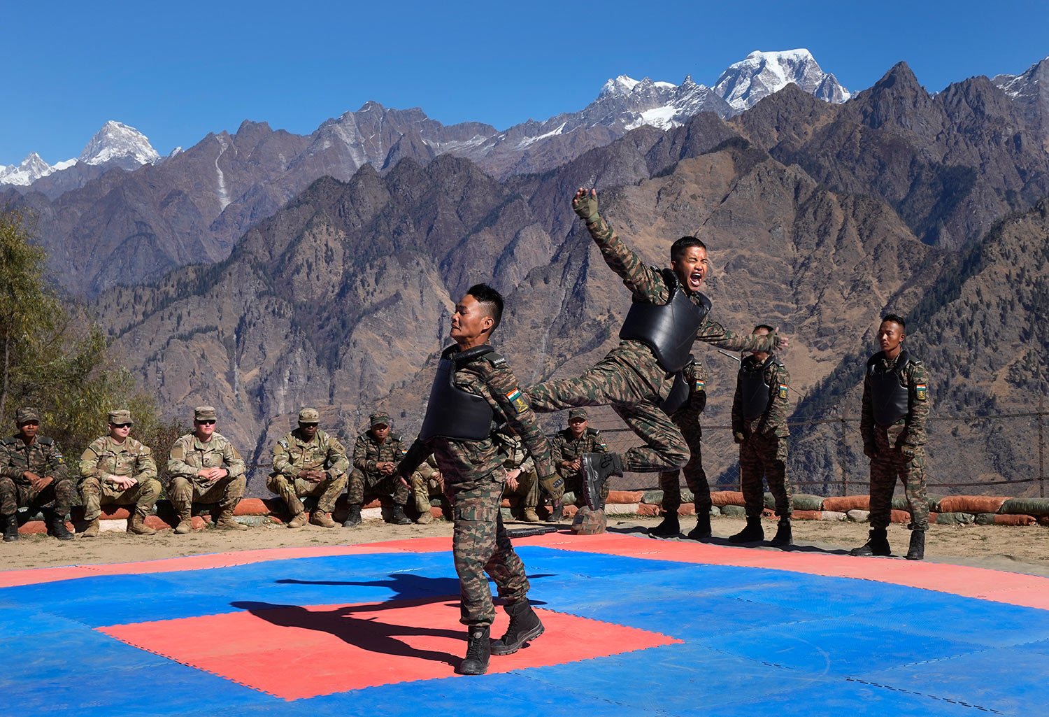 US army soldiers of 2nd Brigade of the 11th Airborne Division watch Indian army soldiers display their unarmed combat skills during the Indo-US joint exercise or "Yudh Abhyas, in Auli, in the Indian state of Uttarakhand, Tuesday, Nov. 29, 2022. (AP 
