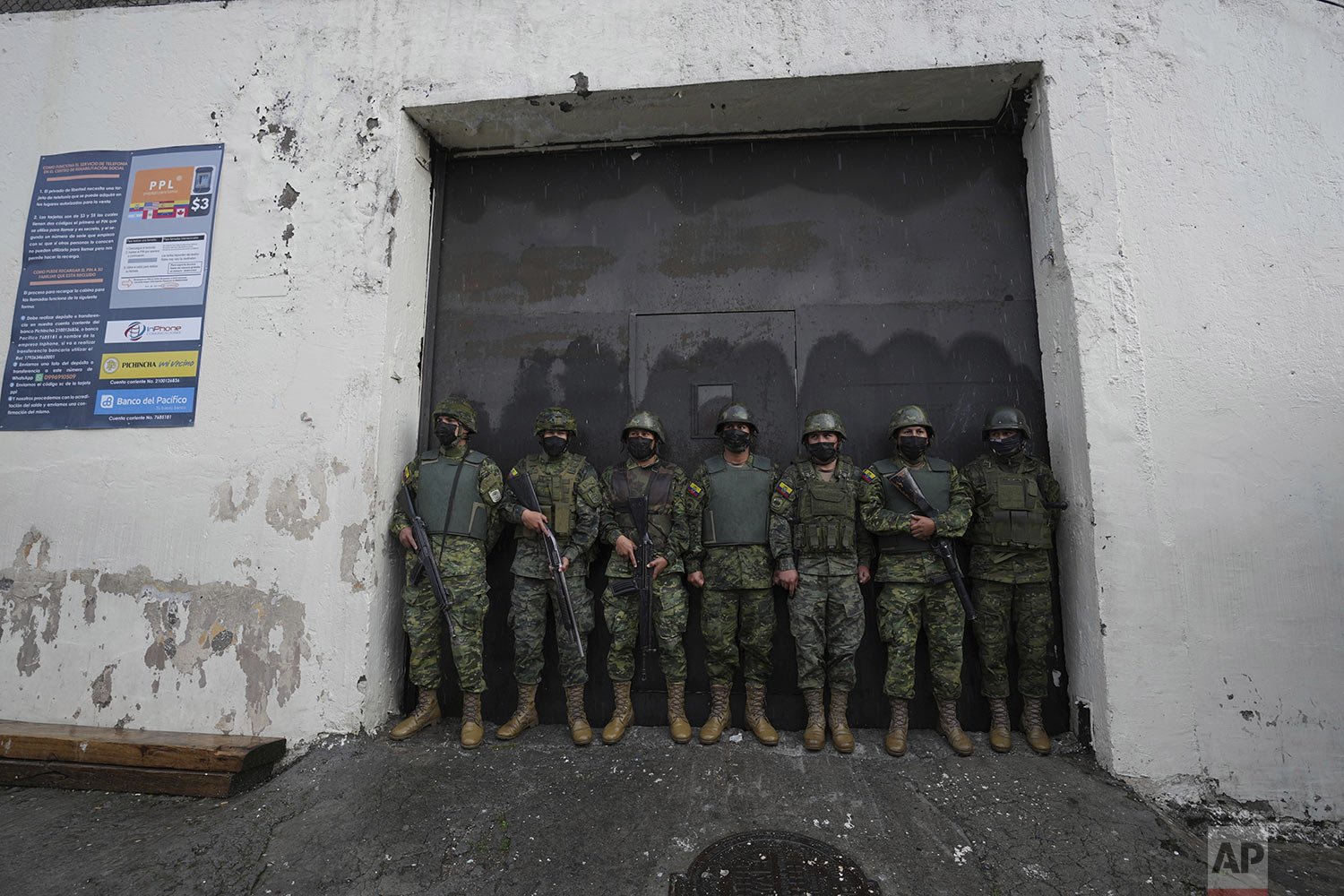  Soldiers guard an entrance to the Inca jail where 10 inmates were killed during a prison riot, according to Police Commander Victor Herrera, in Quito, Ecuador, Friday, Nov. 18, 2022.  (AP Photo/Dolores Ochoa) 