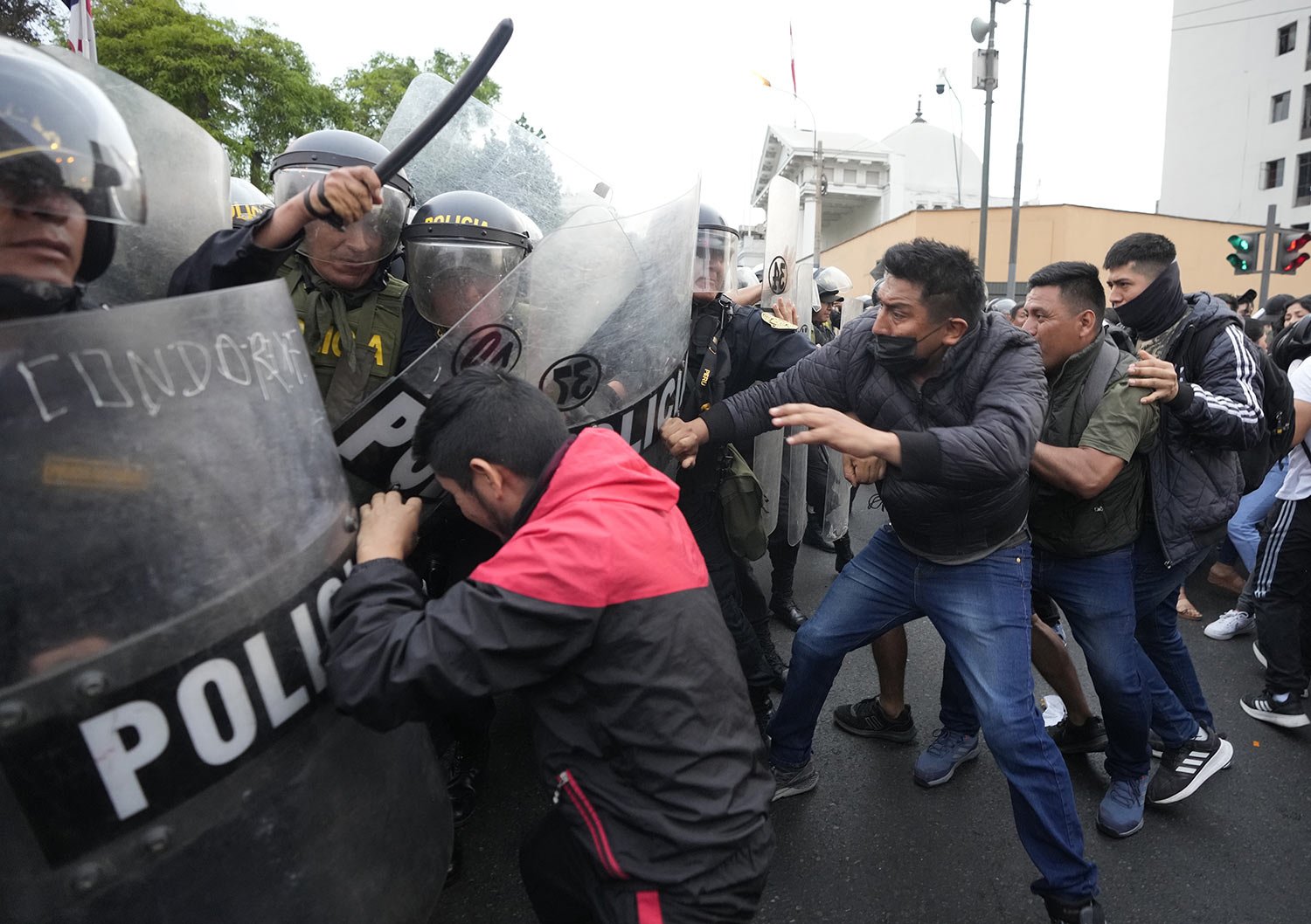  Supporters of ousted President Pedro Castillo clash with police during a protest in Lima, Peru, Thursday, Dec. 8, 2022. (AP Photo/Fernando Vergara) 