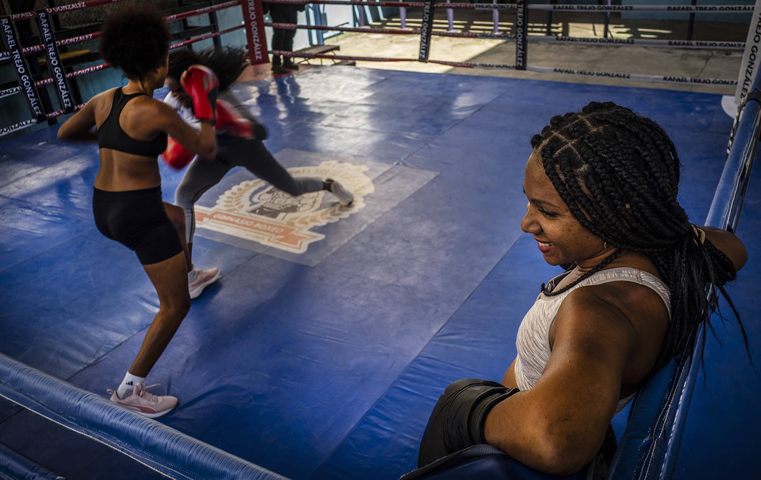  Ydamelys Moreno, right, watches as fellow female boxers train in Havana, Cuba, Monday, Dec. 5, 2022. (AP Photo/Ramon Espinosa) 