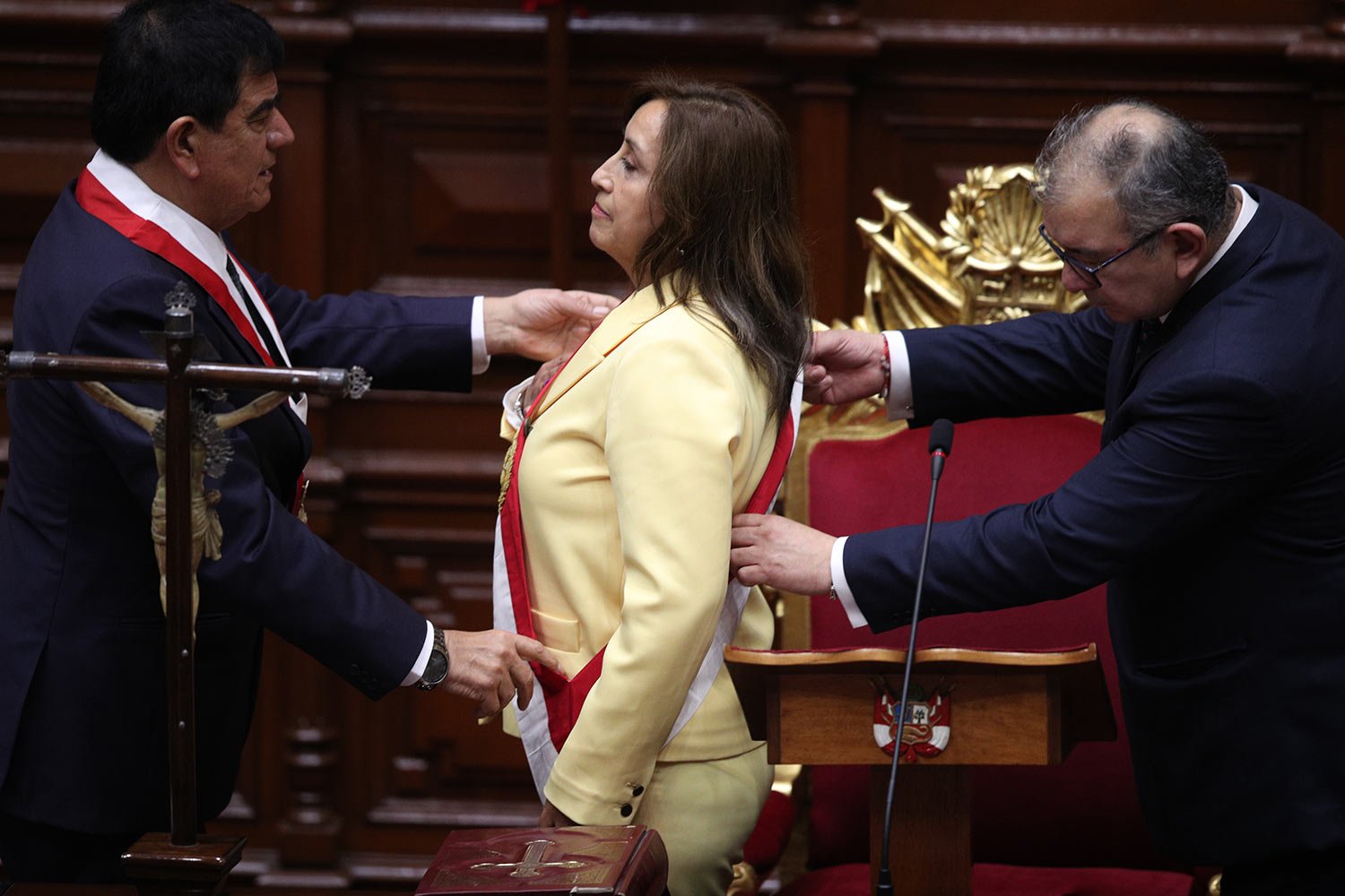  Former Vice President Dina Boluarte receives the presidential sash as she is sworn-in as the new president at Congress in Lima, Peru, Wednesday, Dec. 7, 2022, after Congress voted to remove President Pedro Castillo from office Wednesday. (AP Photo/G