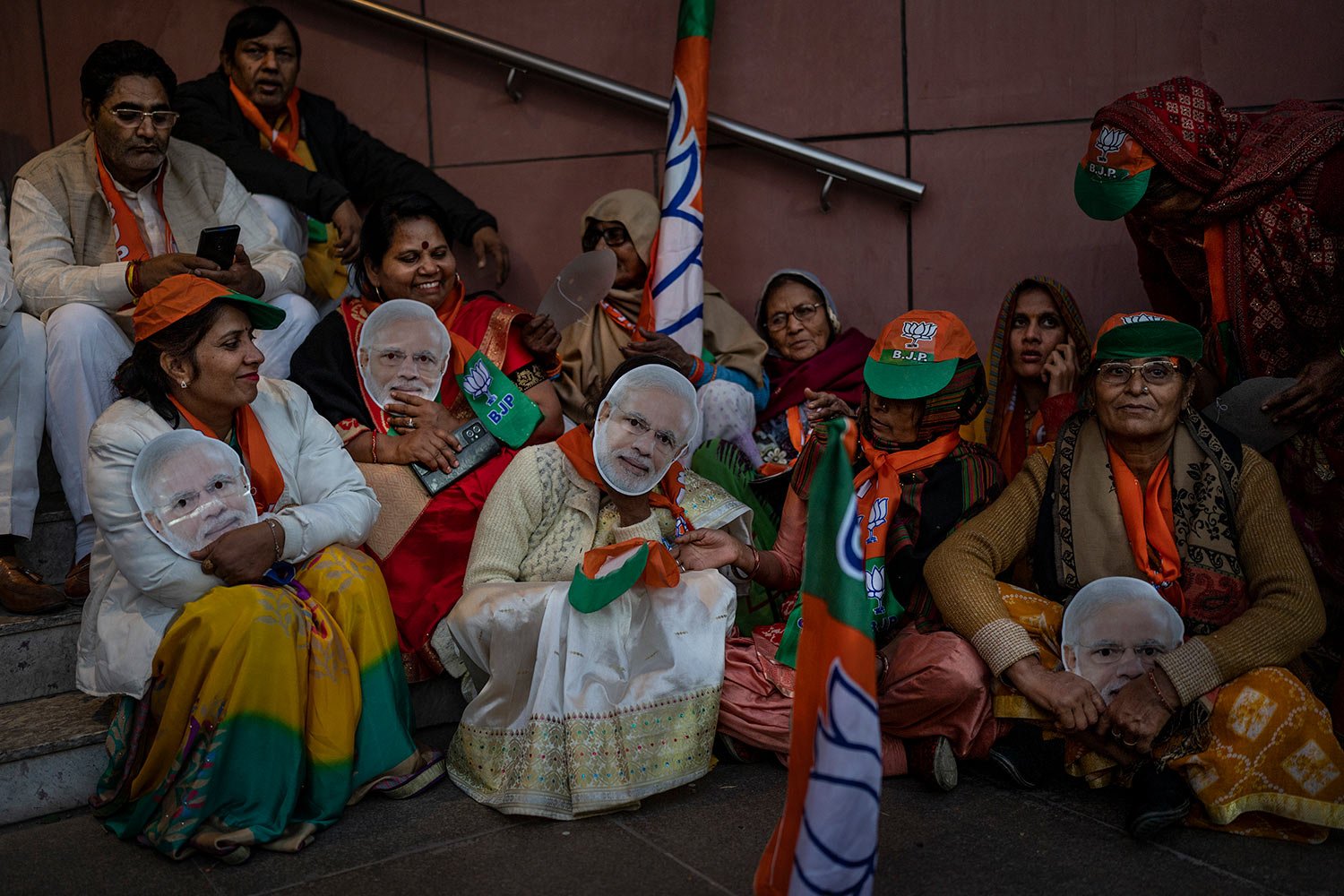  Supporters wear masks of Indian Prime Minister Narendra Modi at the Bharatiya Janata Party (BJP) headquarters in New Delhi, India, Thursday, Dec. 8, 2022. (AP Photo/Altaf Qadri) 