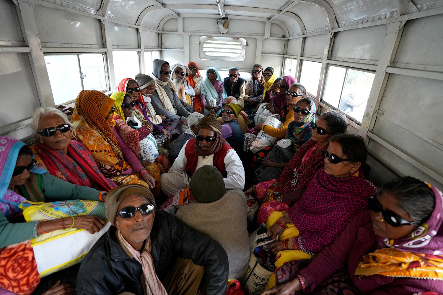  Elderly Indian villagers sit in a vehicle after being discharged from cataract surgery at an eye camp organized by Manohar Das Netra Chikitsalay in Prayagraj, in the northern Indian state of Uttar Pradesh, India. Friday, Dec. 9, 2022. (AP Photo/Raje