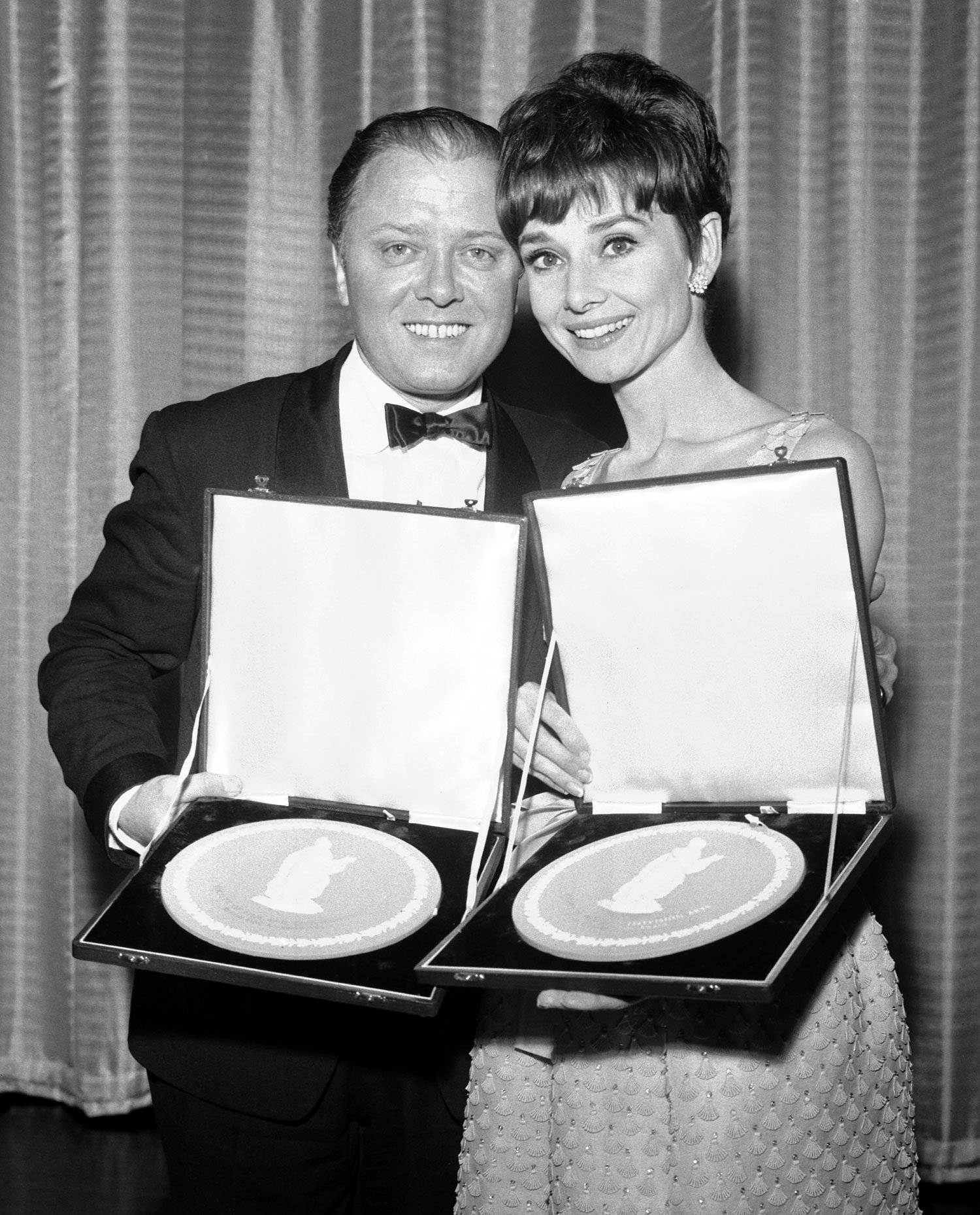  Actor Richard Attenborough, named as best actor in the film "Guns for Batasi", and actress Audrey Hepburn, named as best actress in the film "Charade", pose with their British Film Academy awards after the presentation at the Talk of the Town Theatr