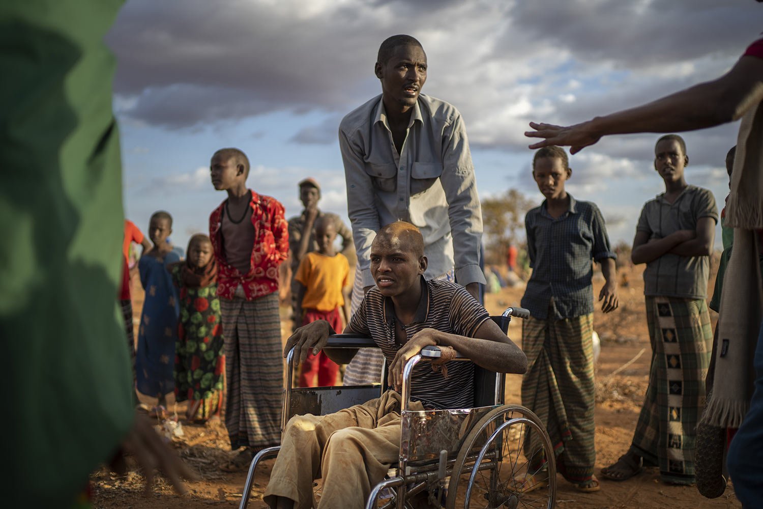  Displaced people who have arrived at a camp wait for plot allocation on the outskirts of Dollow, Somalia, Sept. 19, 2022. (AP Photo/Jerome Delay) 