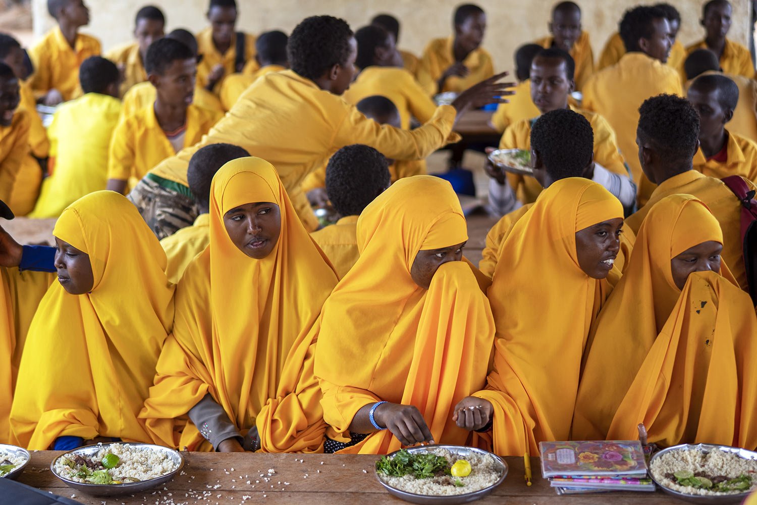  Students eat at a school in Dollow, Somalia, Sept. 19, 2022. (AP Photo/Jerome Delay) 