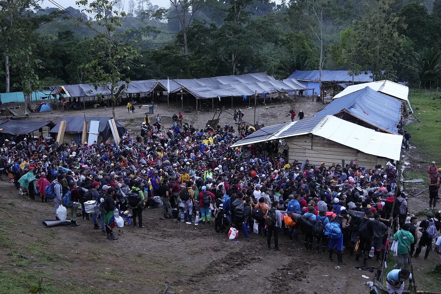  Migrants, mostly Venezuelans, prepare to start crossing the Darien Gap from Colombia into Panama, Oct. 15, 2022. (AP Photo/Fernando Vergara) 